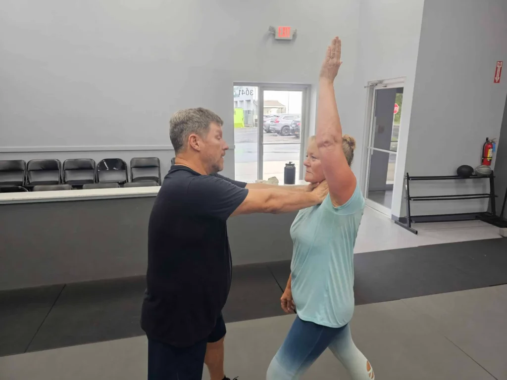 Krav Maga Self-Defense Training- Guardian Krav Maga LLC. Women learning Krav Maga self-defense moves, building confidence and empowerment at Guardian Krav Maga LLC.