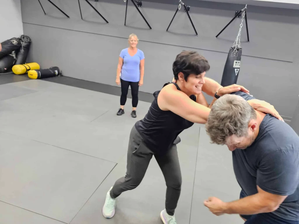 knee striking techniques at Guardian Krav Maga LLC bold, confident women learning knee striking techniques at Guardian Krav Maga LLC